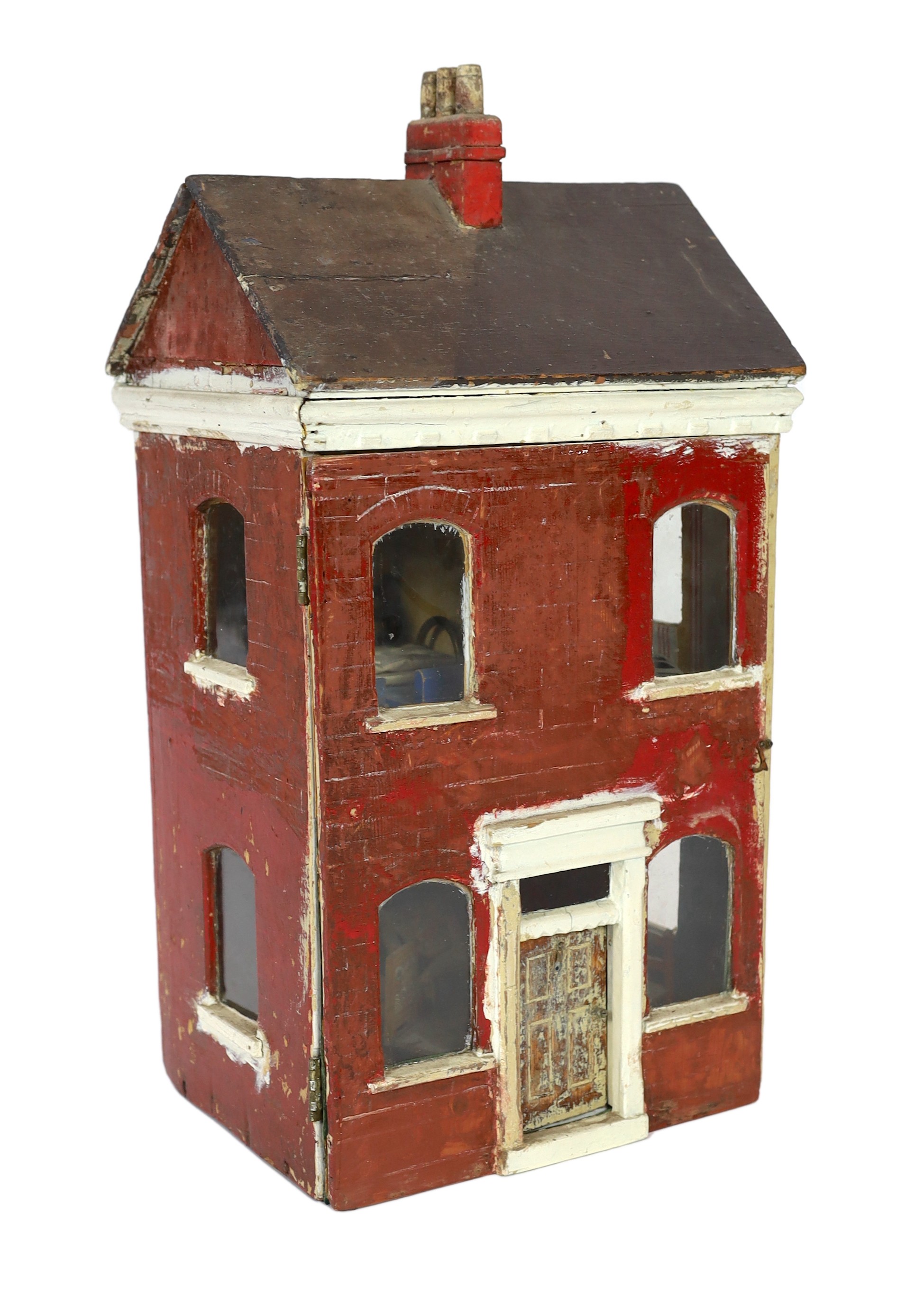 ‘Queens Lynn House’. A late 19th century home-made dolls' house, and contents, 66cm high